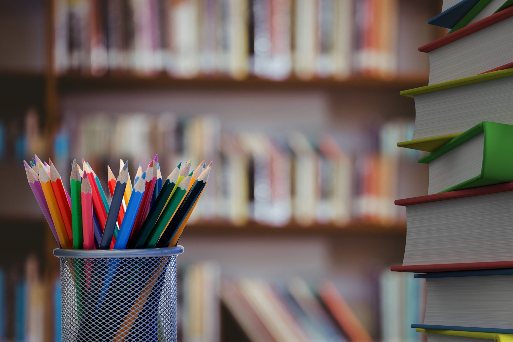 close-up-colored-pencils-with-books